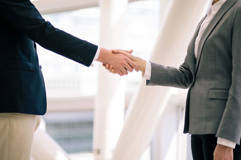 shaking hands to partner with tax consultant